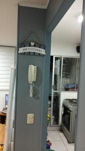 a phone on a wall in a kitchen at departameto 3 dormitorios in Coquimbo
