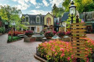 a street with flowers in front of a house at Smoky Mountain Splash in Sevierville