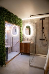 a bathroom with a shower and a sink at Suite la Penida avec Sauna & Baignoire - Hyper Centre Lille in Lille