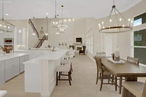 a kitchen and dining room with a table and chairs at 298 5 Bedrooms Fenced yard New Construction in Robstown
