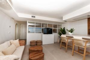 a living room with a couch and a table at eme de Maison - luxury only two in Arenales del Sol