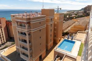 an aerial view of a building with a swimming pool at eme de Maison - luxury only two in Arenales del Sol