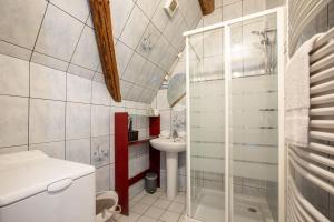 a small bathroom with a sink and a toilet at L'Atypique au coeur du Vignoble in Hunawihr +25 photos