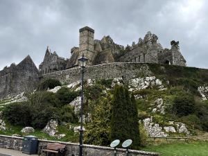 a castle on top of a hill with a street light at Hannah in Cashel