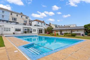 a swimming pool in the backyard of a house at No 26 The Salcombe in Salcombe