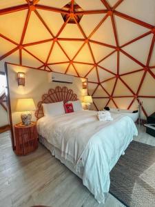 Cama ou camas em um quarto em Embaúba Boutique Hotel