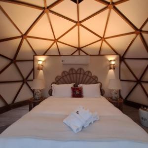Cama ou camas em um quarto em Embaúba Boutique Hotel