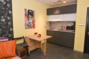 A kitchen or kitchenette at Eli Apartment Burgas Center