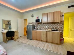 Kuchyň nebo kuchyňský kout v ubytování Belien Apartman