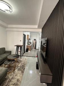 a living room with a couch and a table at Urban Haven Studio in Nairobi