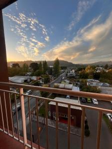 a view of a city from a balcony at Departamento acogedor y céntrico in Temuco