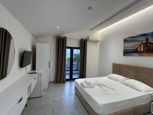 Postel nebo postele na pokoji v ubytování Molla Hotel Restorant