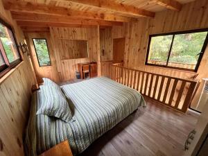 Postel nebo postele na pokoji v ubytování Cabin in Pucón