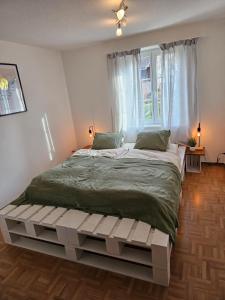 Postel nebo postele na pokoji v ubytování Tegerfelden Weinregion
