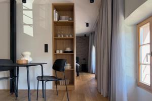 a room with a table and chairs and a window at Klara Rooms in Trittenheim