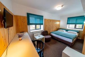Postel nebo postele na pokoji v ubytování Complex Hotelier COTA O MIE