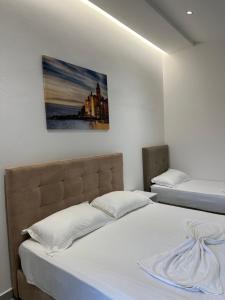 Postel nebo postele na pokoji v ubytování Molla Hotel Restorant