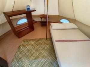 Postel nebo postele na pokoji v ubytování Glamping Campamento Cuetzalan
