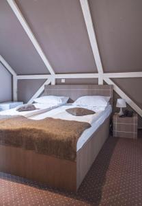 Postel nebo postele na pokoji v ubytování Complex Hotelier COTA O MIE