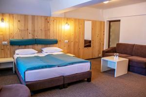 Postel nebo postele na pokoji v ubytování Complex Hotelier COTA O MIE