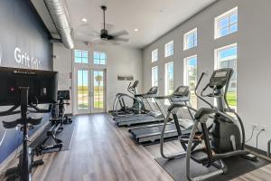 a gym with several treadmills and cardio machines at Sunrise Sunset Repeat in Port Aransas
