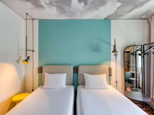 Ένα ή περισσότερα κρεβάτια σε δωμάτιο στο ibis Berlin Kurfuerstendamm - neu renoviert