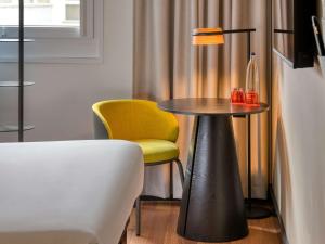 Ένα ή περισσότερα κρεβάτια σε δωμάτιο στο ibis Berlin Kurfuerstendamm - neu renoviert
