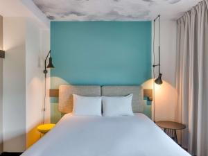 Ένα ή περισσότερα κρεβάτια σε δωμάτιο στο ibis Berlin Kurfuerstendamm - neu renoviert