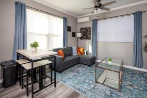 a living room with a couch and a table at Little Rock - Stylish Little Rock Downtown Escape in Little Rock +25 photos