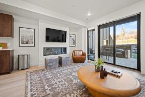 a living room with a coffee table and a large window at Snowbasin Vista Retreat Pt C106 Wkly Disc in Eden