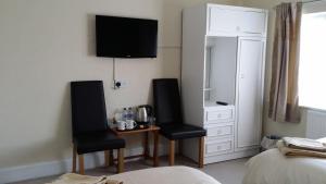 Postel nebo postele na pokoji v ubytování The Saxby Hotel