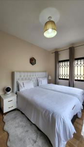 Postel nebo postele na pokoji v ubytování Marblearch Apartment