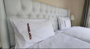 Postel nebo postele na pokoji v ubytování Marblearch Apartment