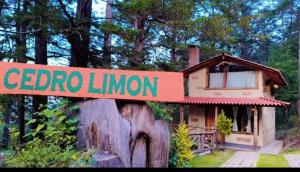 a sign that says ceder limilion on a tree stump at Cedro L in Mineral del Chico