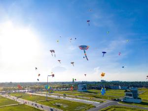 a bunch of kites flying in the sky at Chung cư Nam Long 2 Central Lake - Block E in Cái Răng