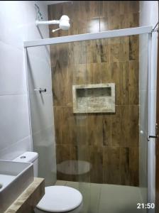 a bathroom with a shower with a toilet and a sink at Dunas residence casa 15- Lençois Maranhense in Santo Amaro