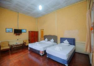 Postel nebo postele na pokoji v ubytování CATIMOR HERITAGE 1894 Hotel & Resto By Celcius + 21 fotografií