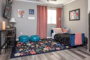 a bedroom with a bed and a rug at Little Rock - Cozy Downtown Retreat in Little Rock
