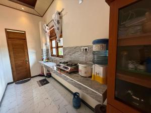 a kitchen with a counter and a counter top at Arana Holiday Resort in Kurundankulama