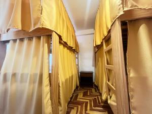 a hallway with yellow curtains in a room at jtjy in San Antonio