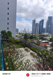 a view of a city from a building with benches at Condo unit open for staycation in Manila +8 photos
