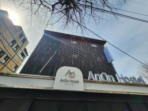 a sign on top of a building with a akron hospital at Anon hostel in Seoul