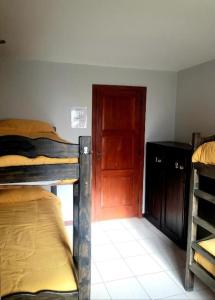 En eller flere senge i et værelse på Olimpo Hostel