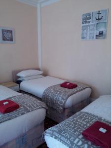 A bed or beds in a room at Park Inn Hotel Folkestone 