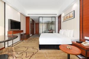 深圳国际会展中心凯嘉酒店-Shenzhen Kaijia Hotel-Shenzhen-World客房内的一张或多张床位