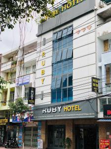 a building with a hucky hotel sign on it at Rubyhotel nha trang in Nha Trang