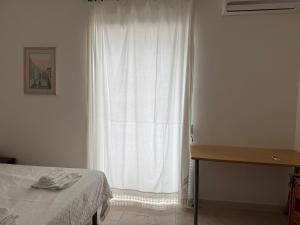 Ένα ή περισσότερα κρεβάτια σε δωμάτιο στο Peschici a Due Passi