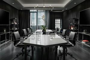 a conference room with a long table and chairs at BISHA, a Luxury Collection Hotel, Toronto in Toronto