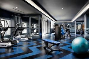a gym with treadmills ellipticals and exercise machines at BISHA, a Luxury Collection Hotel, Toronto in Toronto