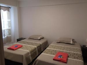 En eller flere senge i et værelse på Departamento en pleno centro